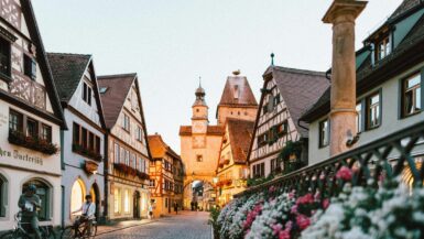 Small town in Germany lit up during the early evening.